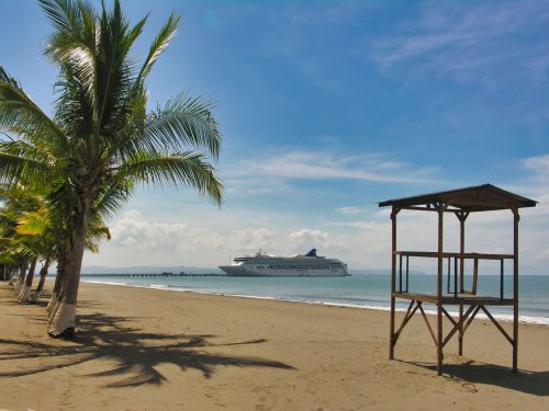 Central America - Costa Rica - Puntarenas - Playa Puntarenas with Palm Trees and Cruise Ship Norwegian Spirit