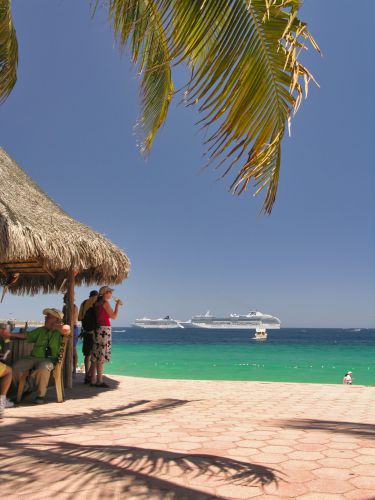 Mexico - Cabo San Lucas - Beach - Playa El Medano with Beach Bar and anchoring Cruise Ships Norwegian Spirit and Coral Princess